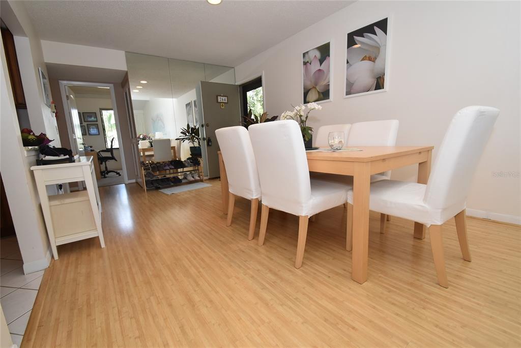 1512 Pelican Point Drive, Unit BA264 Sarasota, FL 34231 - Photo 4 of 44 a view of a dining room with furniture and wooden floor