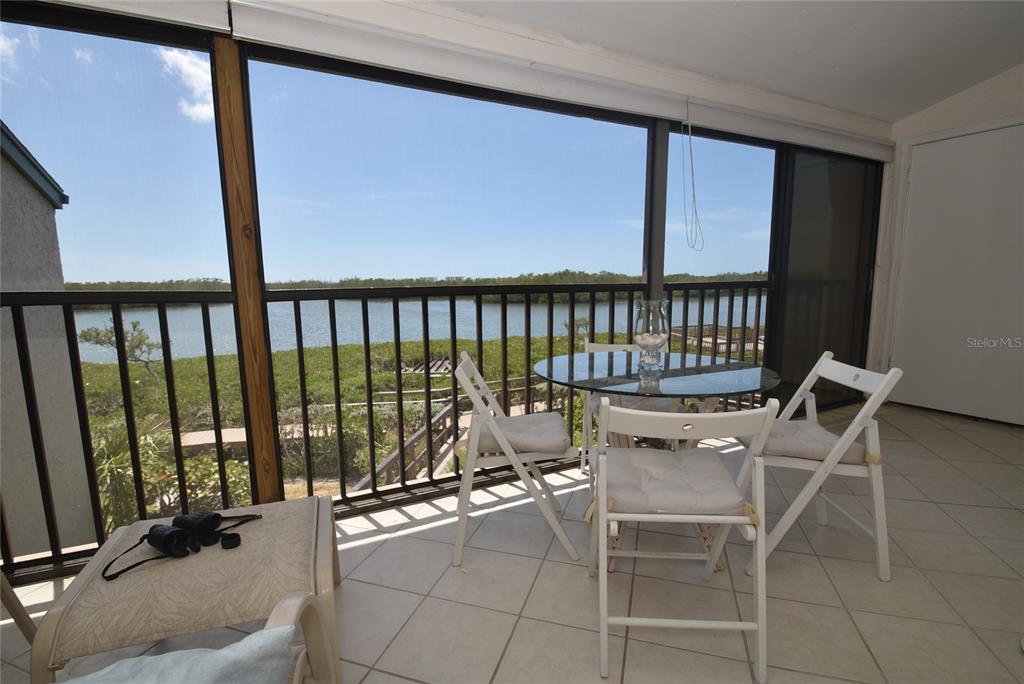 1512 Pelican Point Drive, Unit BA264 Sarasota, FL 34231 - Photo 7 of 44 a view of a balcony with chairs