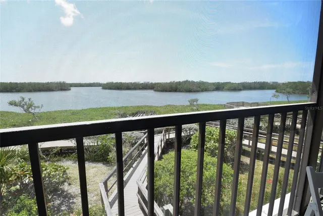 a view of a balcony with chairs