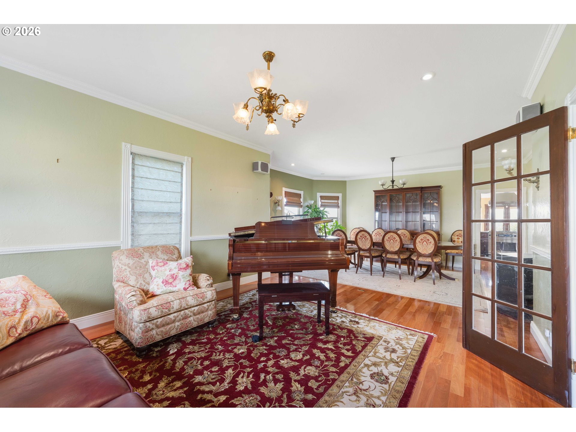2139 McPherson Avenue North Bend, OR 97459 - Photo 12 of 35 a living room with furniture a dining table and a piano table