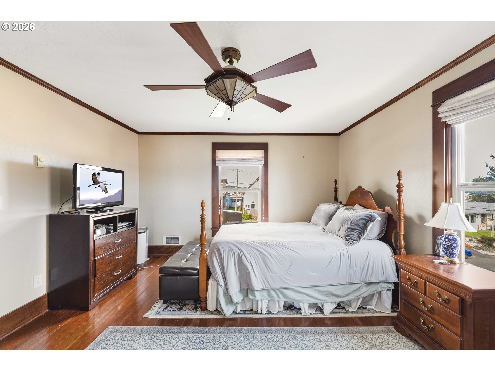 2139 McPherson Avenue North Bend, OR 97459 - Photo 15 of 35 a bedroom with a bed and wooden floor