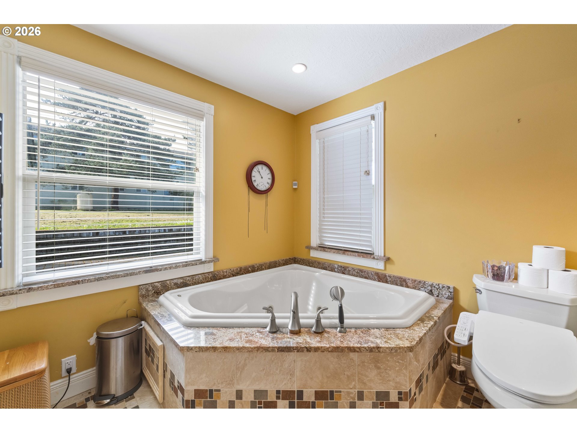 2139 McPherson Avenue North Bend, OR 97459 - Photo 18 of 35 a bathroom with a tub sink and mirror
