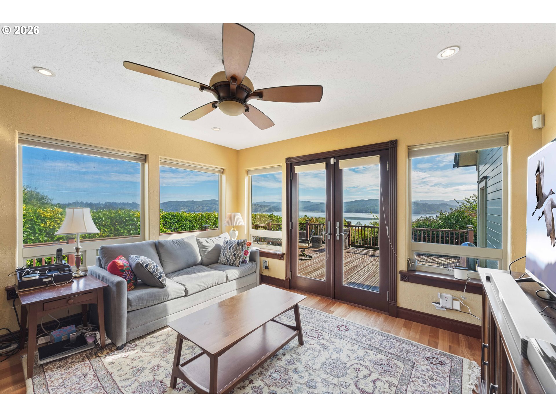 2139 McPherson Avenue North Bend, OR 97459 - Photo 2 of 35 a living room with furniture and a large window