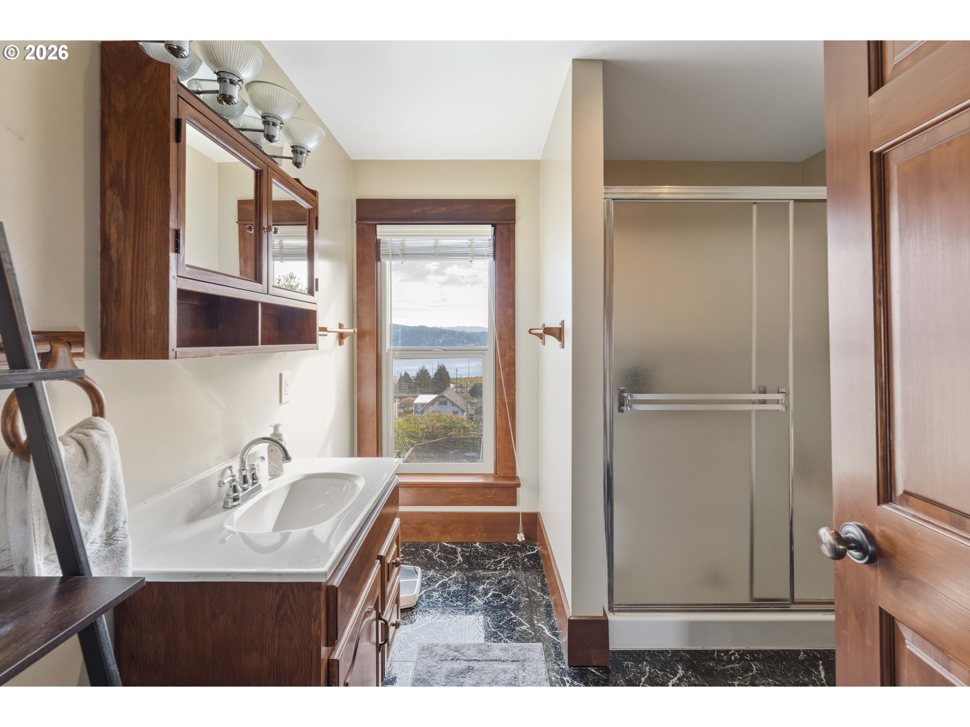 2139 McPherson Avenue North Bend, OR 97459 - Photo 27 of 35 a bathroom with a sink and a mirror