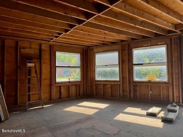 an aerial view of a house with a yard and potted plants