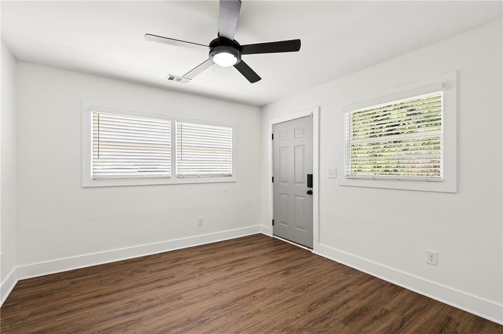 1344 Midlawn Drive Decatur, GA 30032 - Photo 66 of 87 a view of an empty room with wooden floor and a window