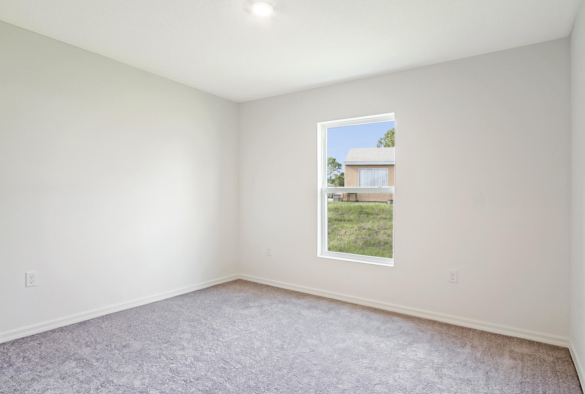 1237 Haulover Road Southwest Palm Bay, FL 32908 - Photo 11 of 15 an empty room with a window
