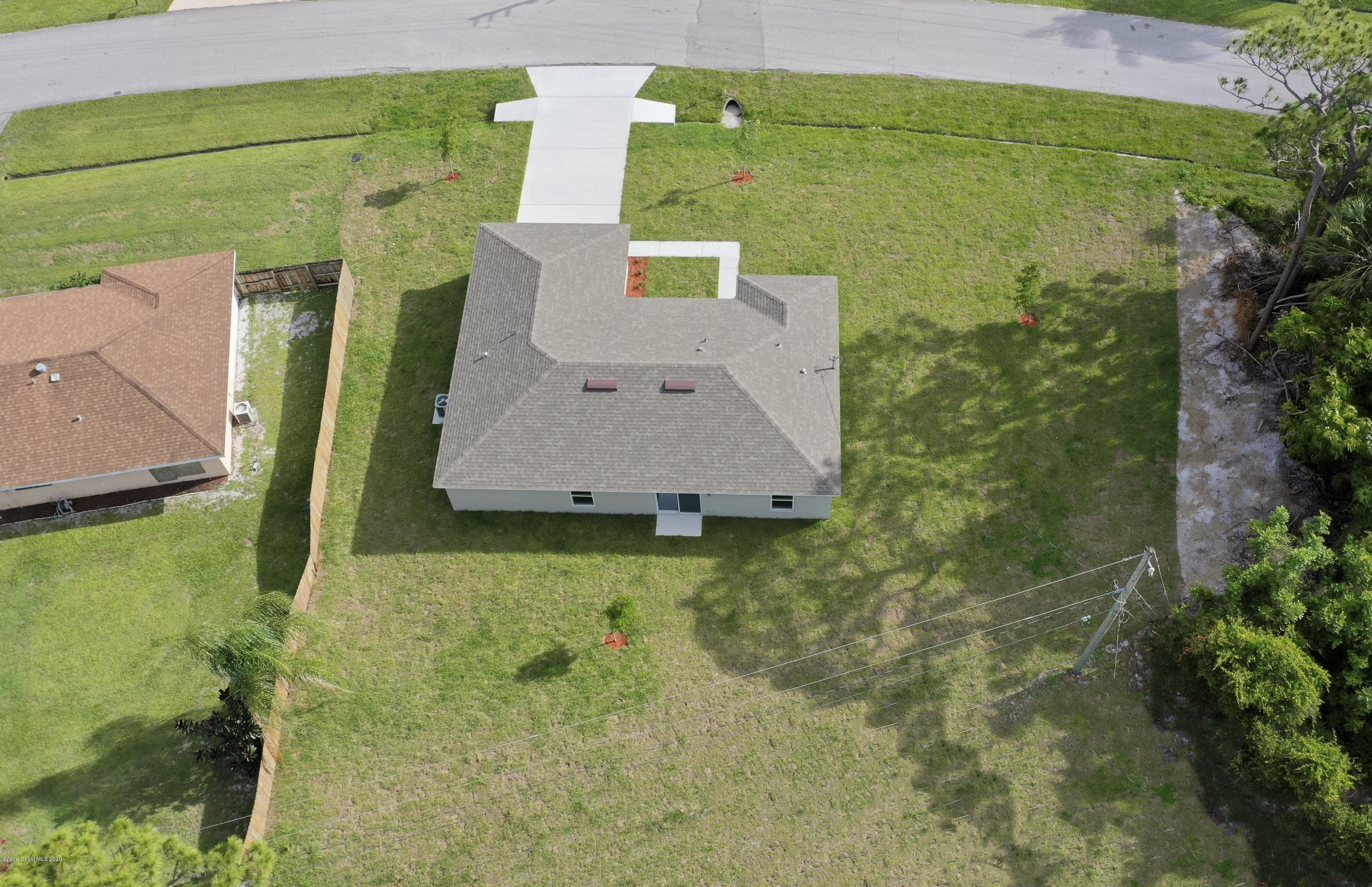 1237 Haulover Road Southwest Palm Bay, FL 32908 - Photo 15 of 15 an aerial view of a house with a yard
