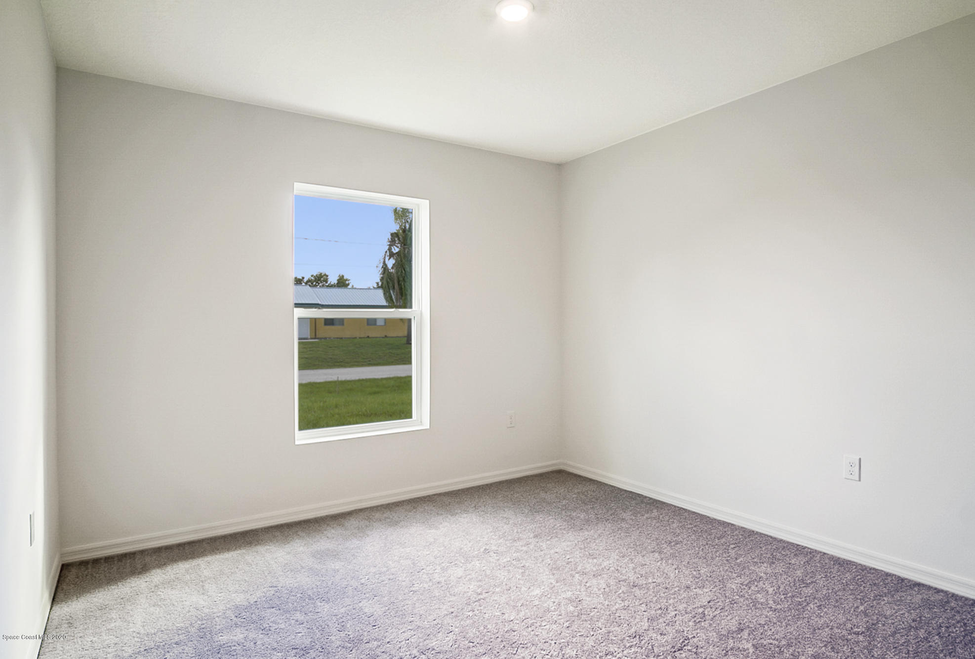 1237 Haulover Road Southwest Palm Bay, FL 32908 - Photo 8 of 15 a view of an empty room with a window