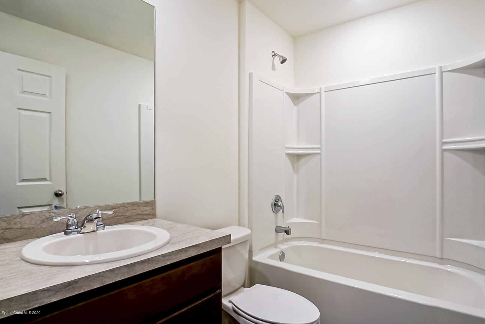 1237 Haulover Road Southwest Palm Bay, FL 32908 - Photo 9 of 15 a bathroom with a sink toilet tub and shower