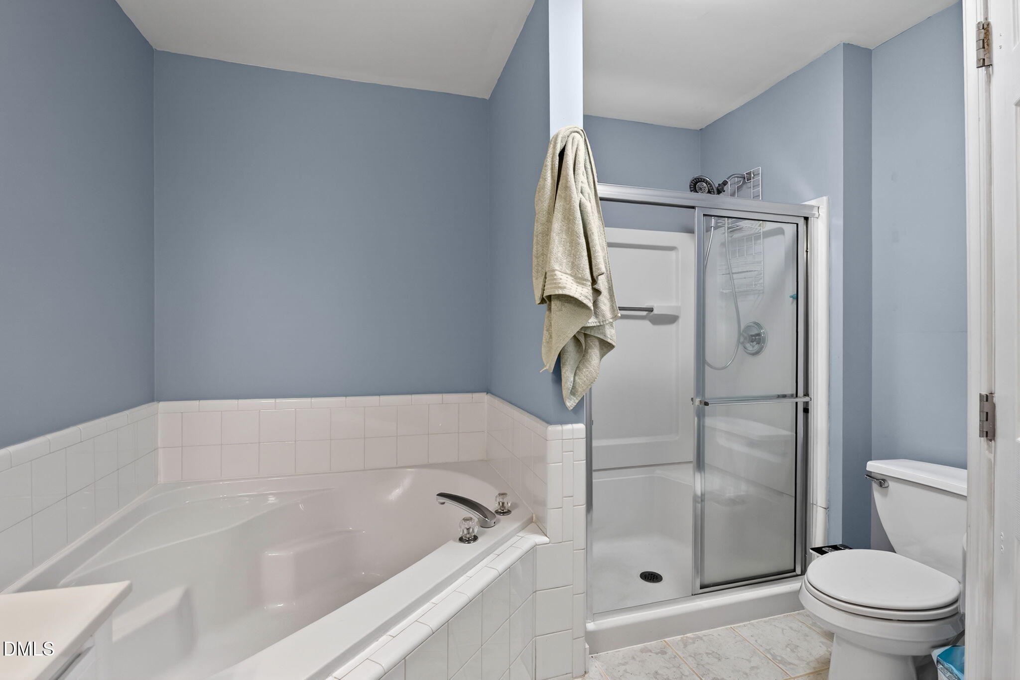 5500 Vista View Court Raleigh, NC 27612 - Photo 27 of 38 a bathroom with a bathtub and a shower