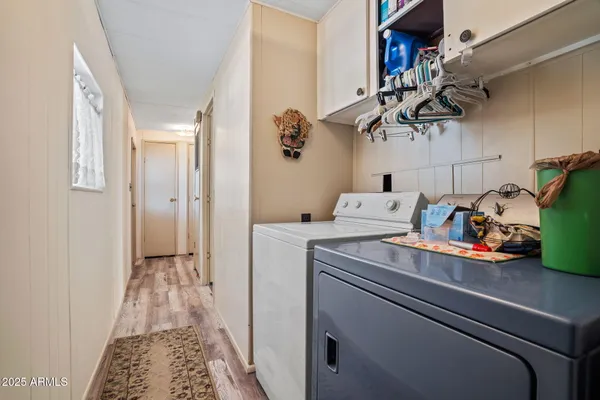 a living room with furniture and a book shelf