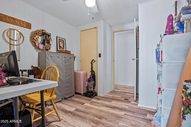 a bedroom with a large bed and a book shelf
