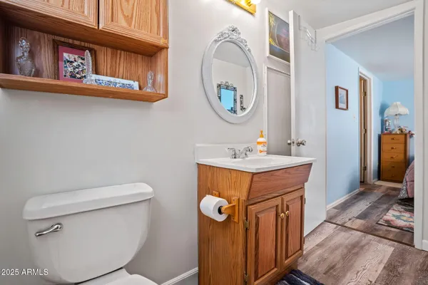 a kitchen with a table chairs and a refrigerator