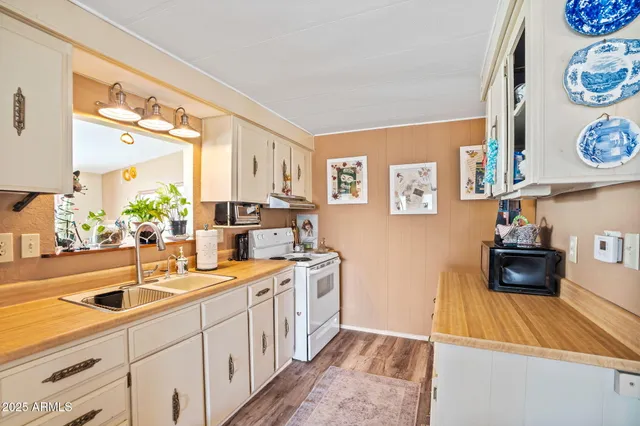 a kitchen with a stove and a sink