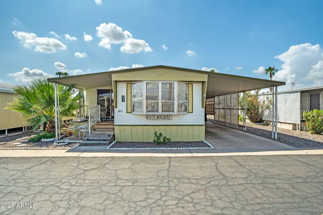 a street sign on a sidewalk next to a road