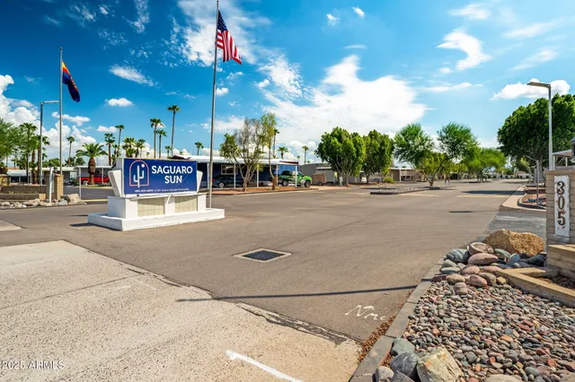 a view of a swimming pool with a yard