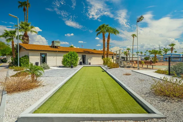 a room with pool table and chairs