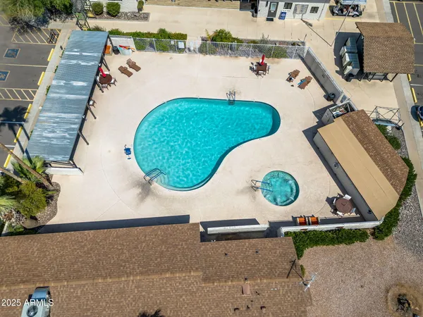a view of swimming pool with a patio