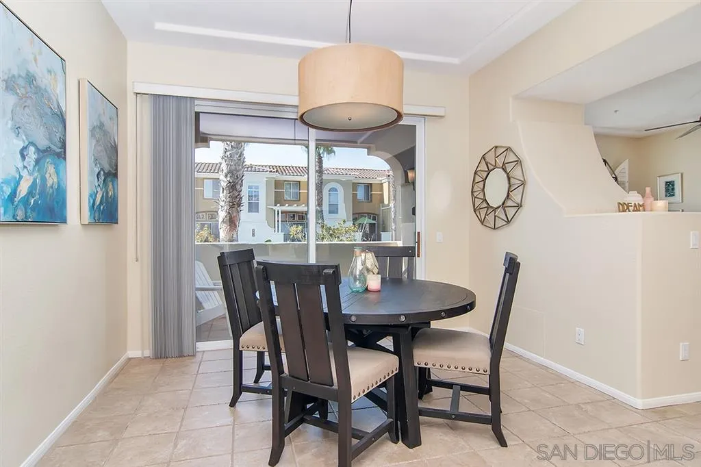 2230 Historic Decatur Road, Unit 63 San Diego, CA 92106 - Photo 8 of 25 a view of a dining room with furniture and window