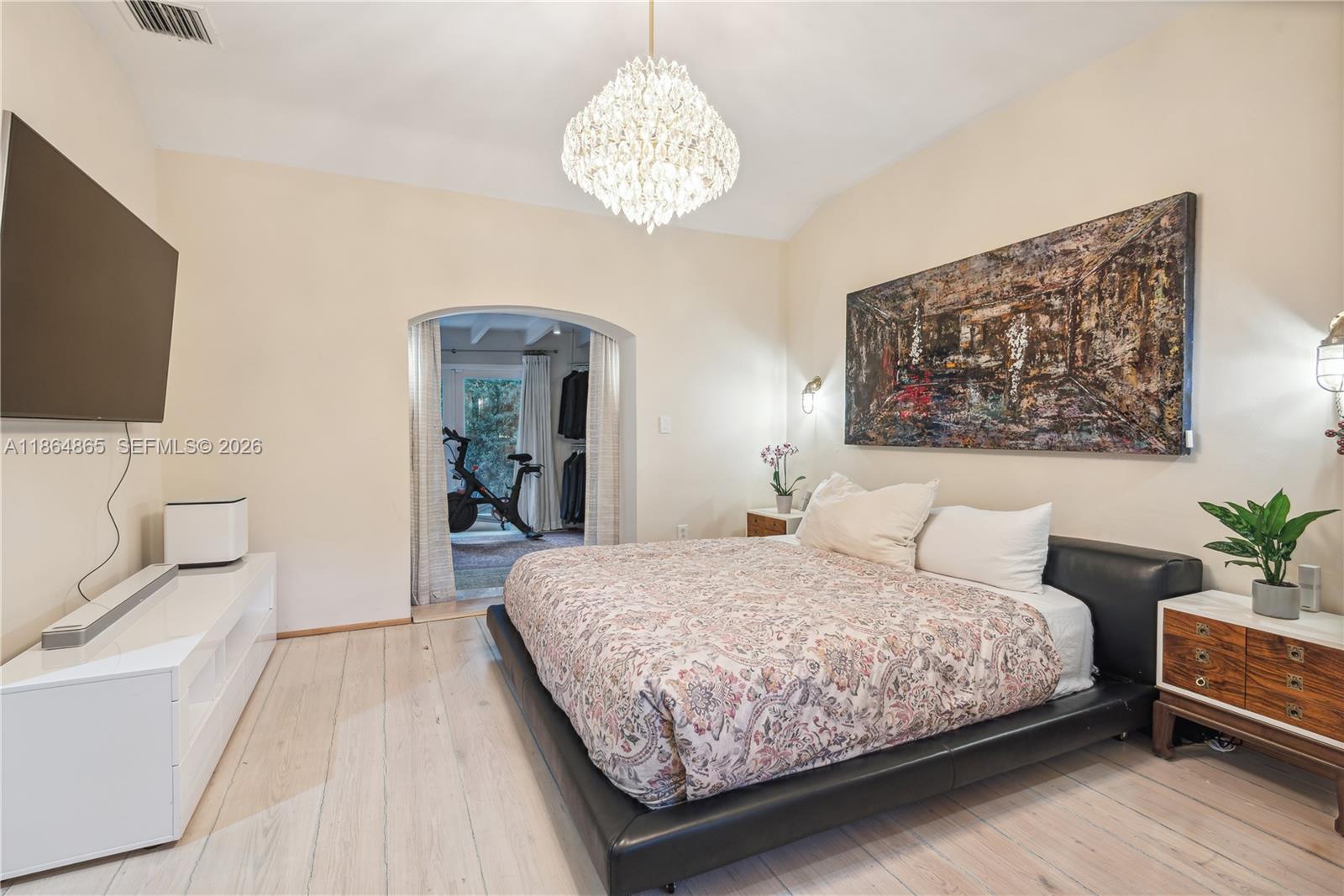 6350 Pine Tree Drive Miami Beach, FL 33140 - Photo 18 of 32 a bedroom with a bed and a flat screen tv