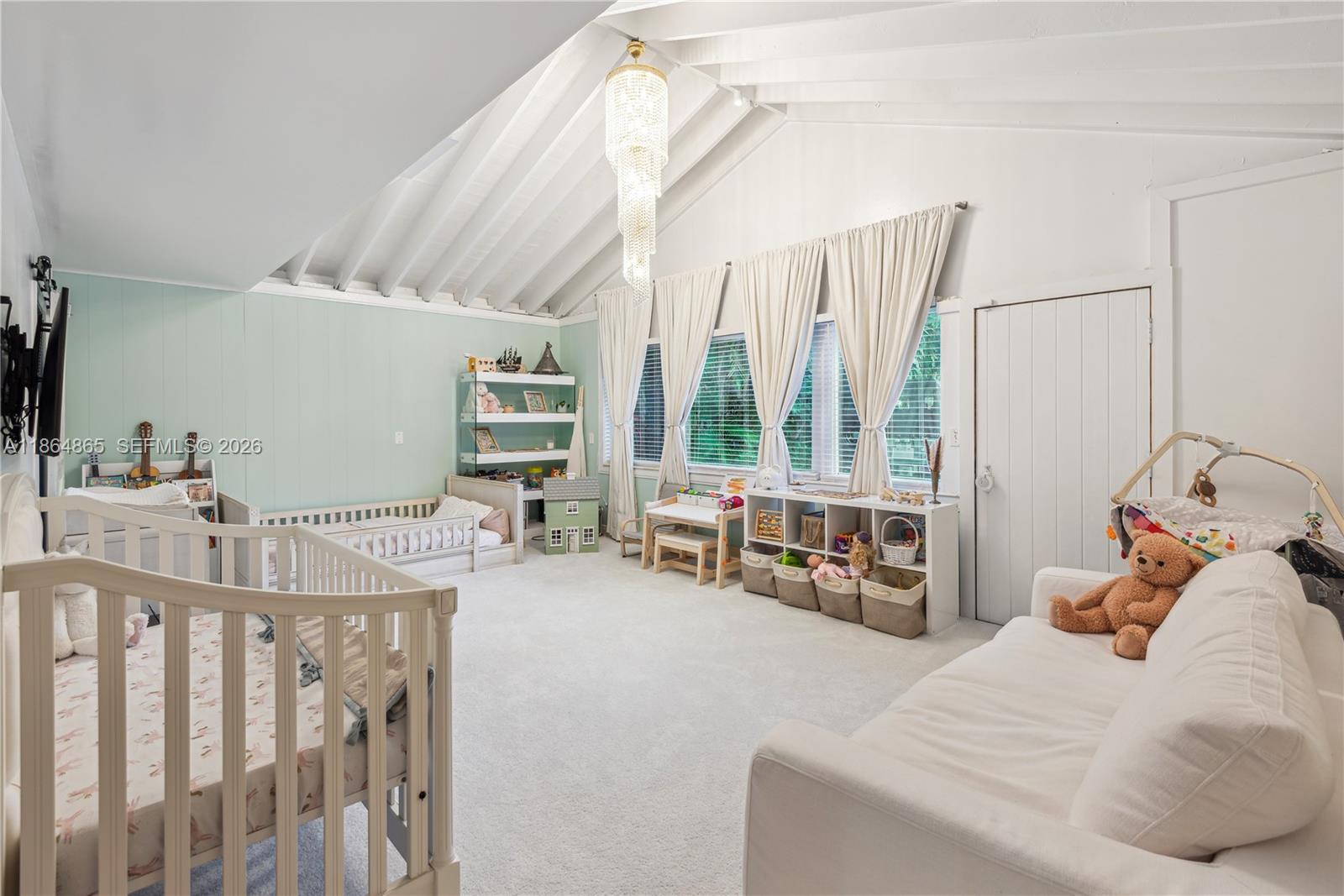 6350 Pine Tree Drive Miami Beach, FL 33140 - Photo 25 of 32 a bedroom with furniture and a large window