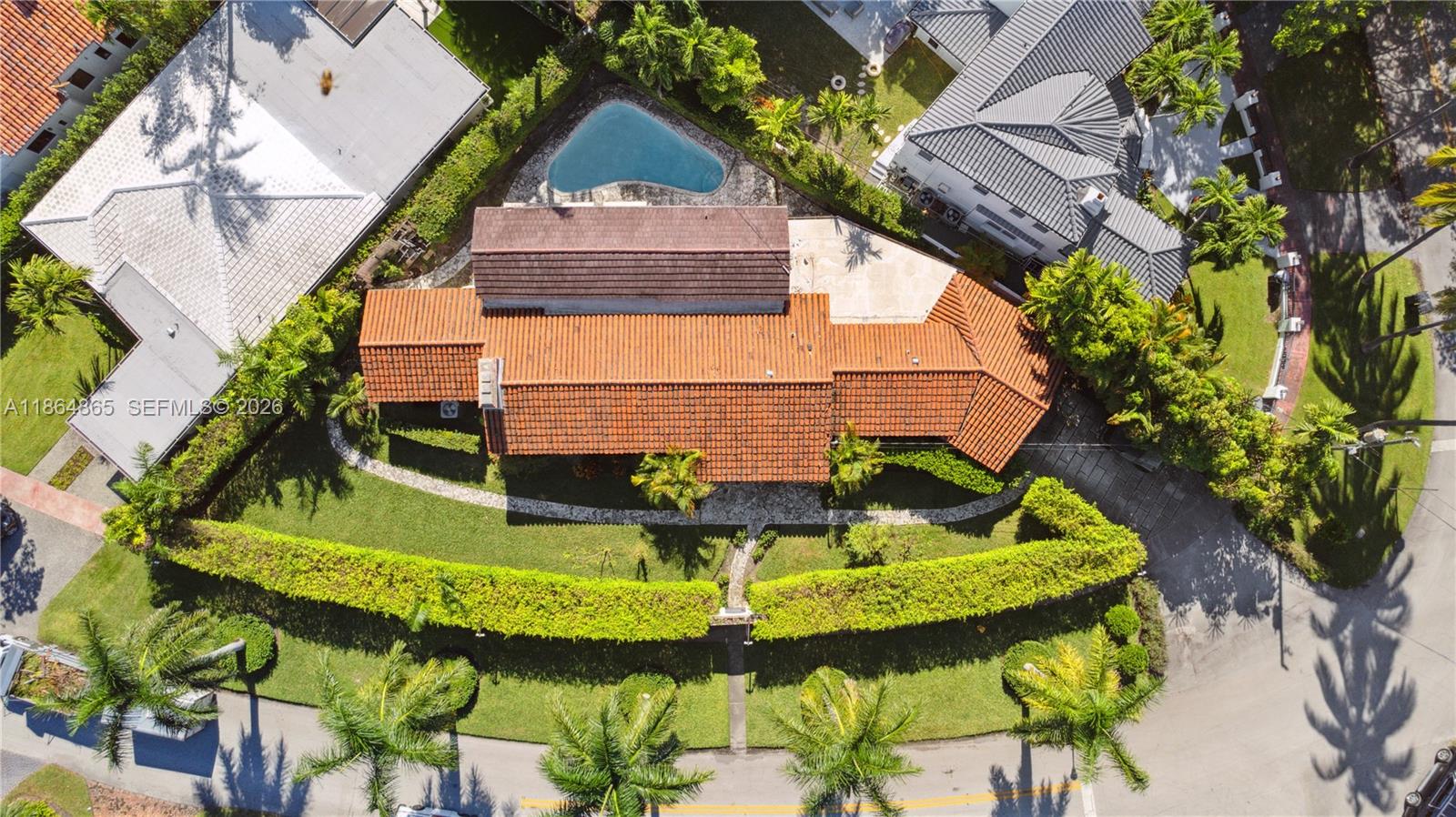 6350 Pine Tree Drive Miami Beach, FL 33140 - Photo 26 of 32 an aerial view of a house with swimming pool