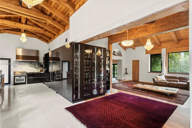 a kitchen with stainless steel appliances a sink stove and refrigerator
