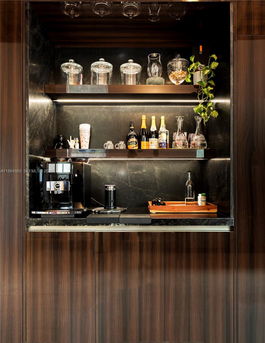 6350 Pine Tree Drive Miami Beach, FL 33140 - Photo 32 of 32 a room with wooden floor