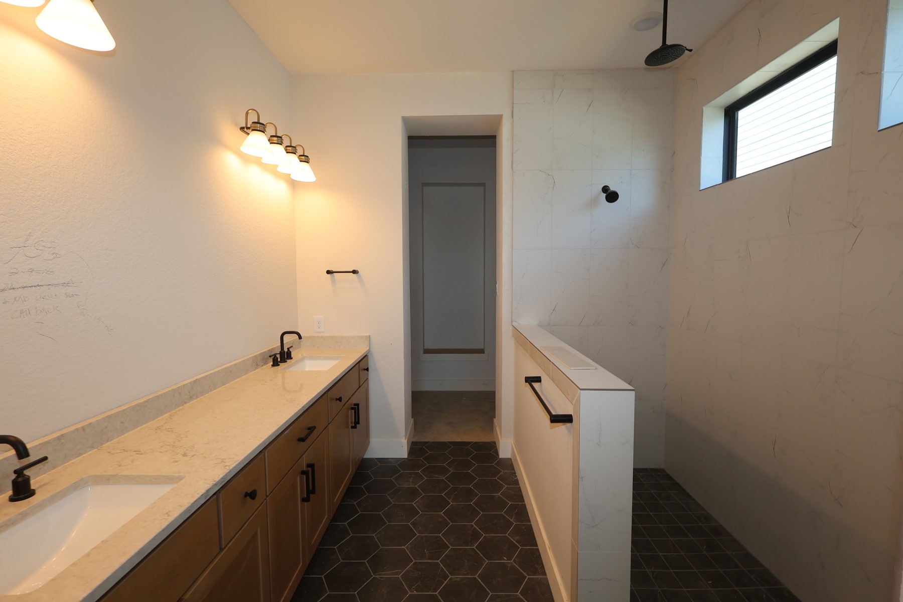 18607 Rumba Court Conroe, TX 77302 - Photo 8 of 20 a bathroom with a double vanity sink and a mirror