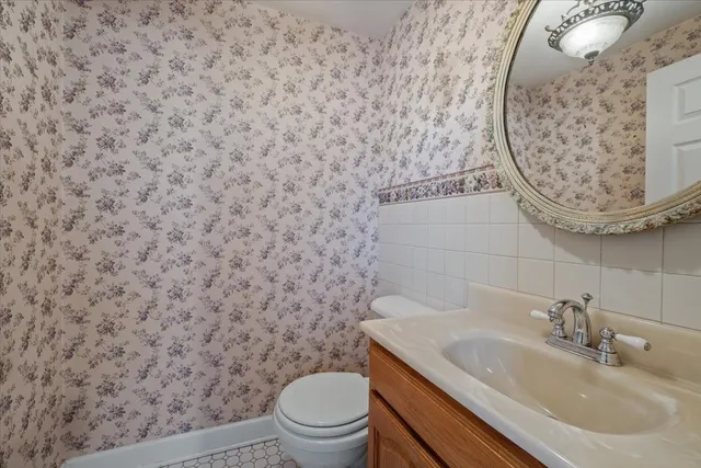 a bathroom with a toilet and a sink