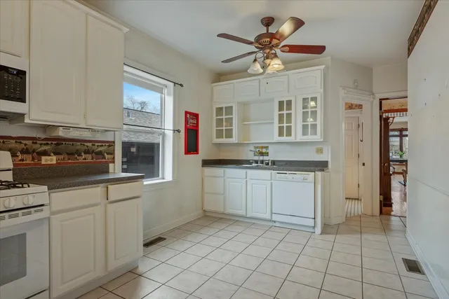 a kitchen with cabinets and window