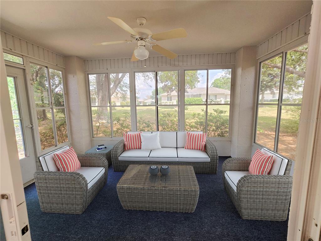 6121 Southwest 103rd Loop Ocala, FL 34476 - Photo 11 of 32 a living room with furniture and large windows