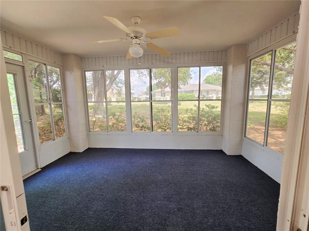 6121 Southwest 103rd Loop Ocala, FL 34476 - Photo 12 of 32 a view of room with window and front door