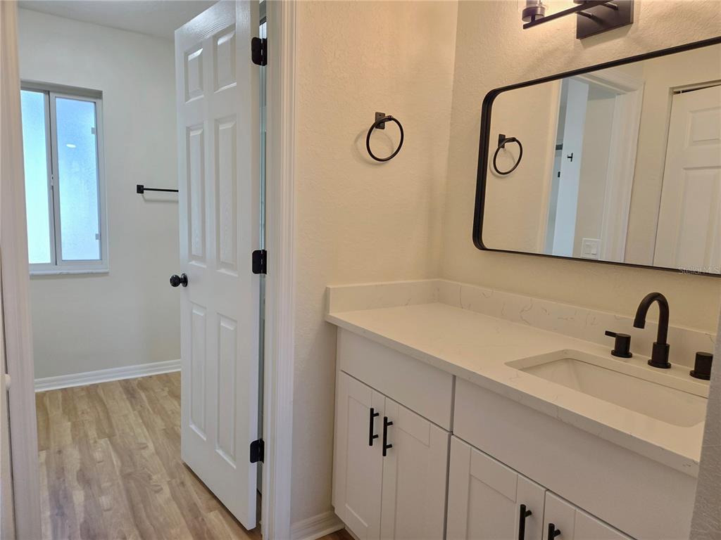 6121 Southwest 103rd Loop Ocala, FL 34476 - Photo 28 of 32 a bathroom with a sink and a mirror