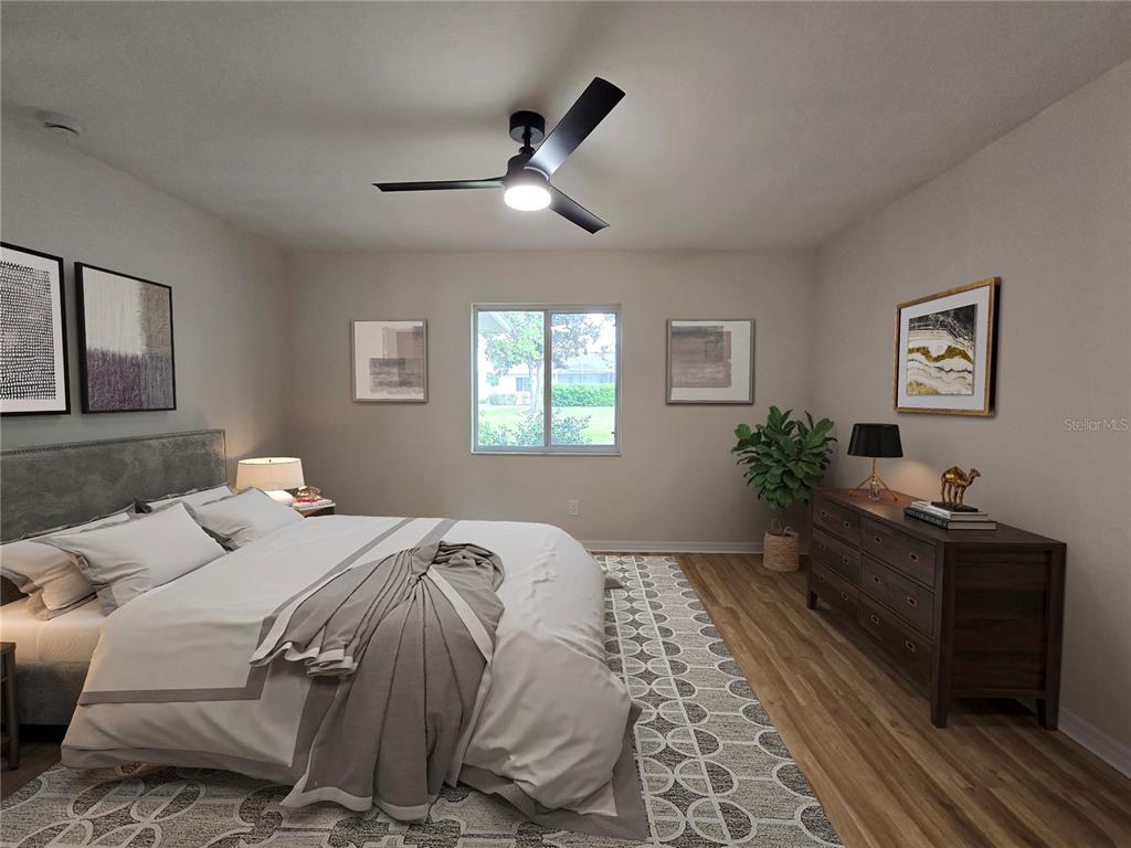 6121 Southwest 103rd Loop Ocala, FL 34476 - Photo 30 of 32 a bedroom with a bed and a dresser