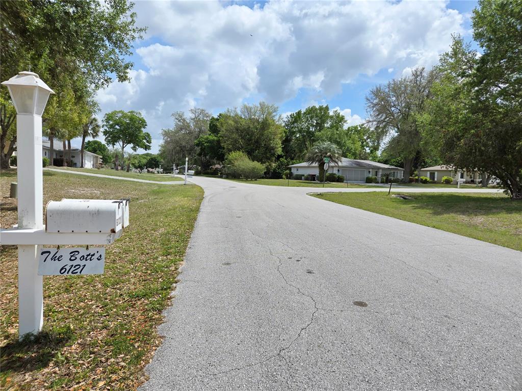 6121 Southwest 103rd Loop Ocala, FL 34476 - Photo 3 of 32 a view of a fountain with a big yard