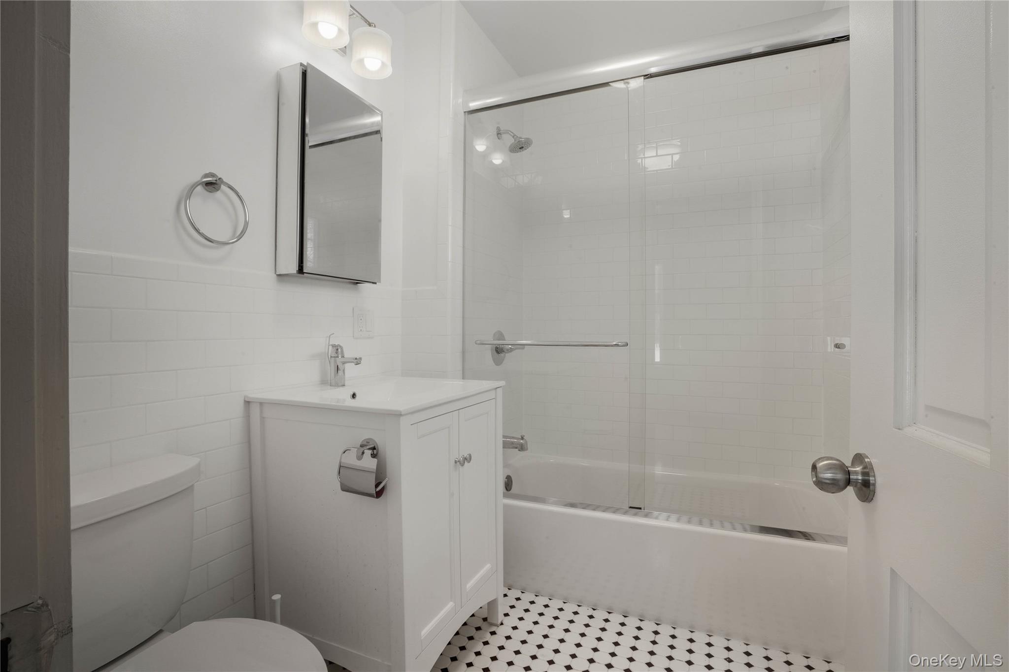 1091 Albany Post Road Gardiner, NY 12525 - Photo 15 of 50 a bathroom with a sink a toilet and shower