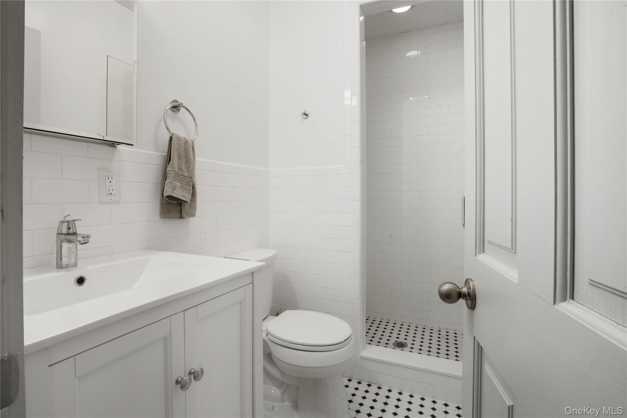 1091 Albany Post Road Gardiner, NY 12525 - Photo 16 of 50 a bathroom with a sink a toilet and shower