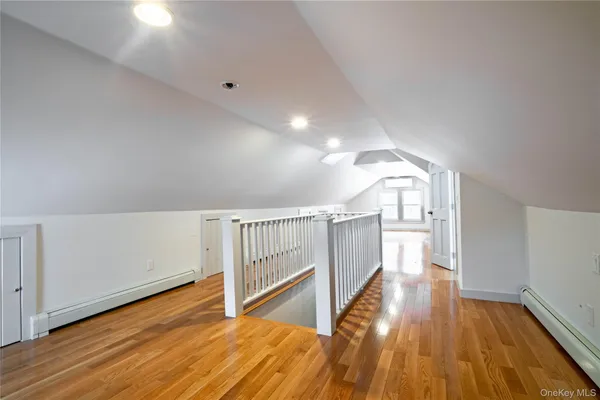 a view of entryway with wooden floor