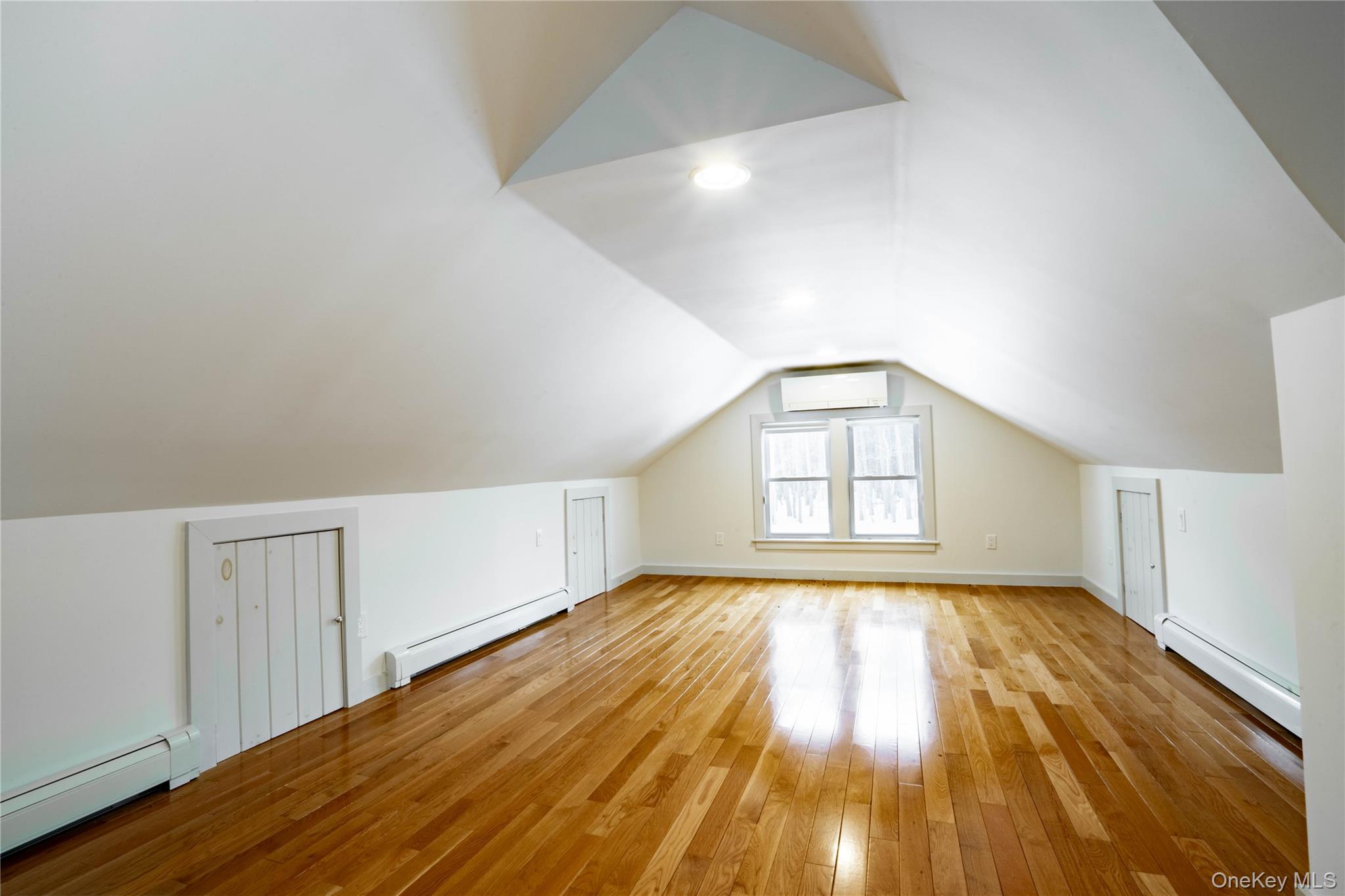 1091 Albany Post Road Gardiner, NY 12525 - Photo 30 of 50 a view of empty room with wooden floor and fan