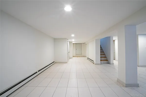 a view of an empty room with closet