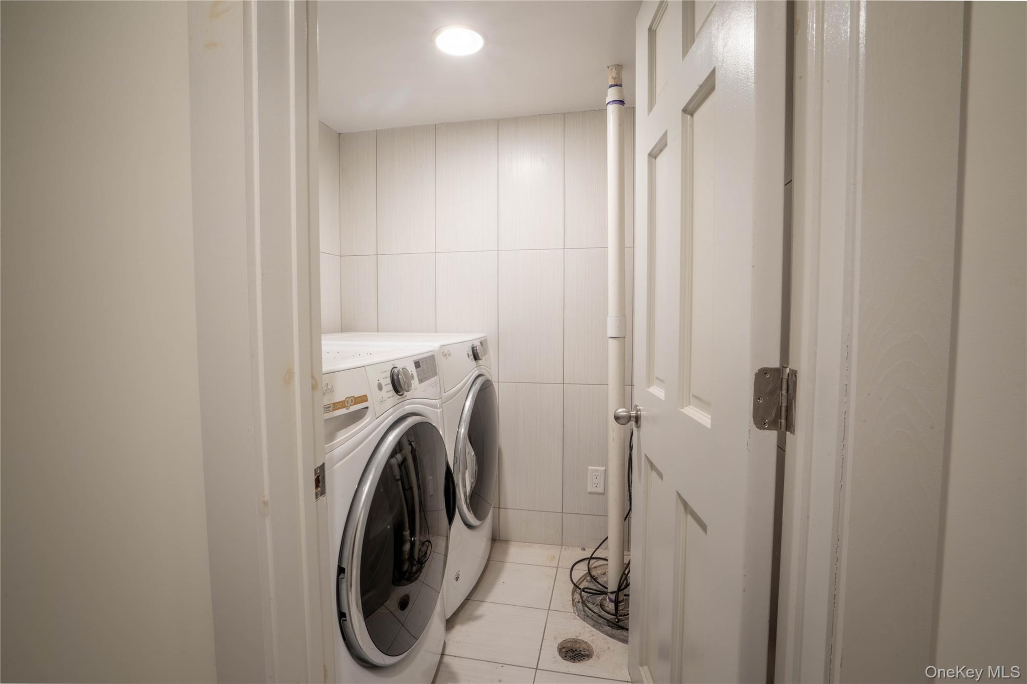 1091 Albany Post Road Gardiner, NY 12525 - Photo 34 of 50 a utility room with dryer and washer
