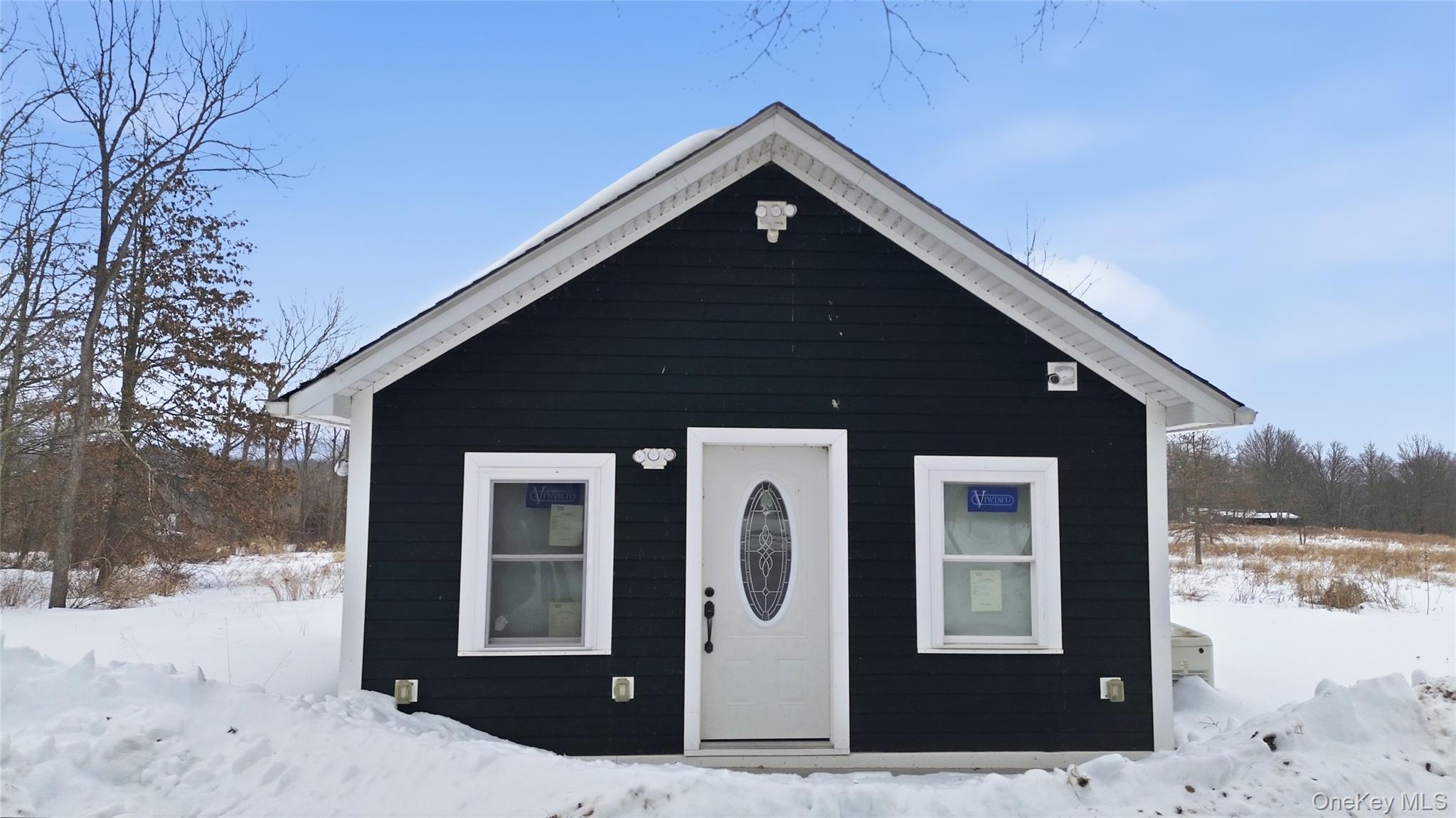 1091 Albany Post Road Gardiner, NY 12525 - Photo 36 of 50 a front view of a house with a yard
