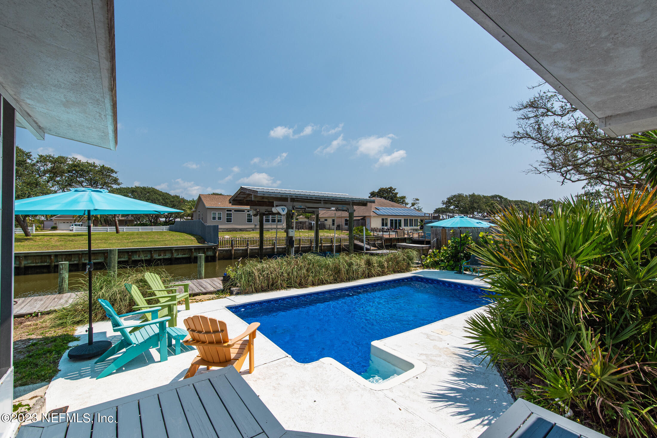 248 Hildago Road St. Augustine, FL 32080 - Photo 5 of 49 a view of a swimming pool with seating space