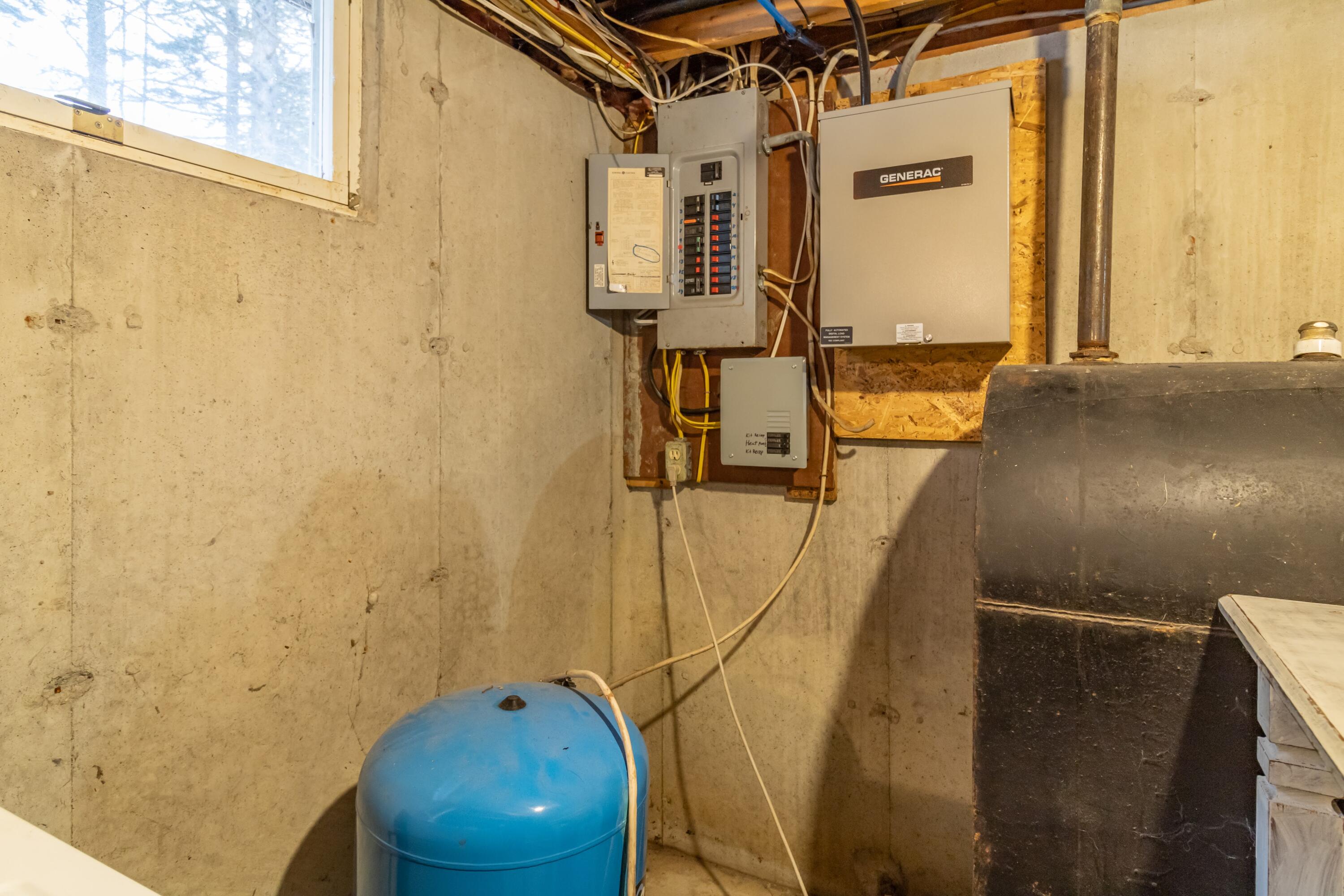 880 Castine Road Castine, ME 04421 - Photo 23 of 50 Electric panel and oil tank