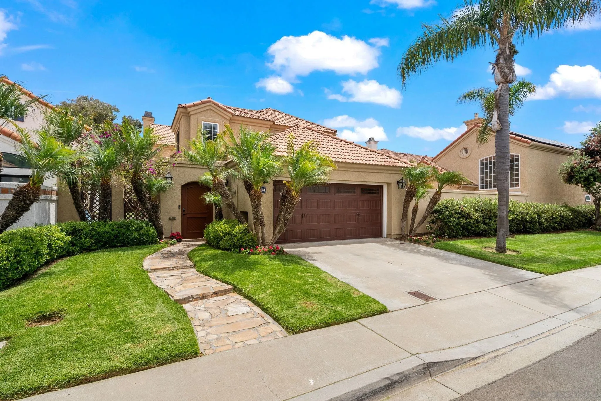 43 Port Royale Road Coronado, CA 92118 - Photo 1 of 42 front view of a house with a yard and potted plants