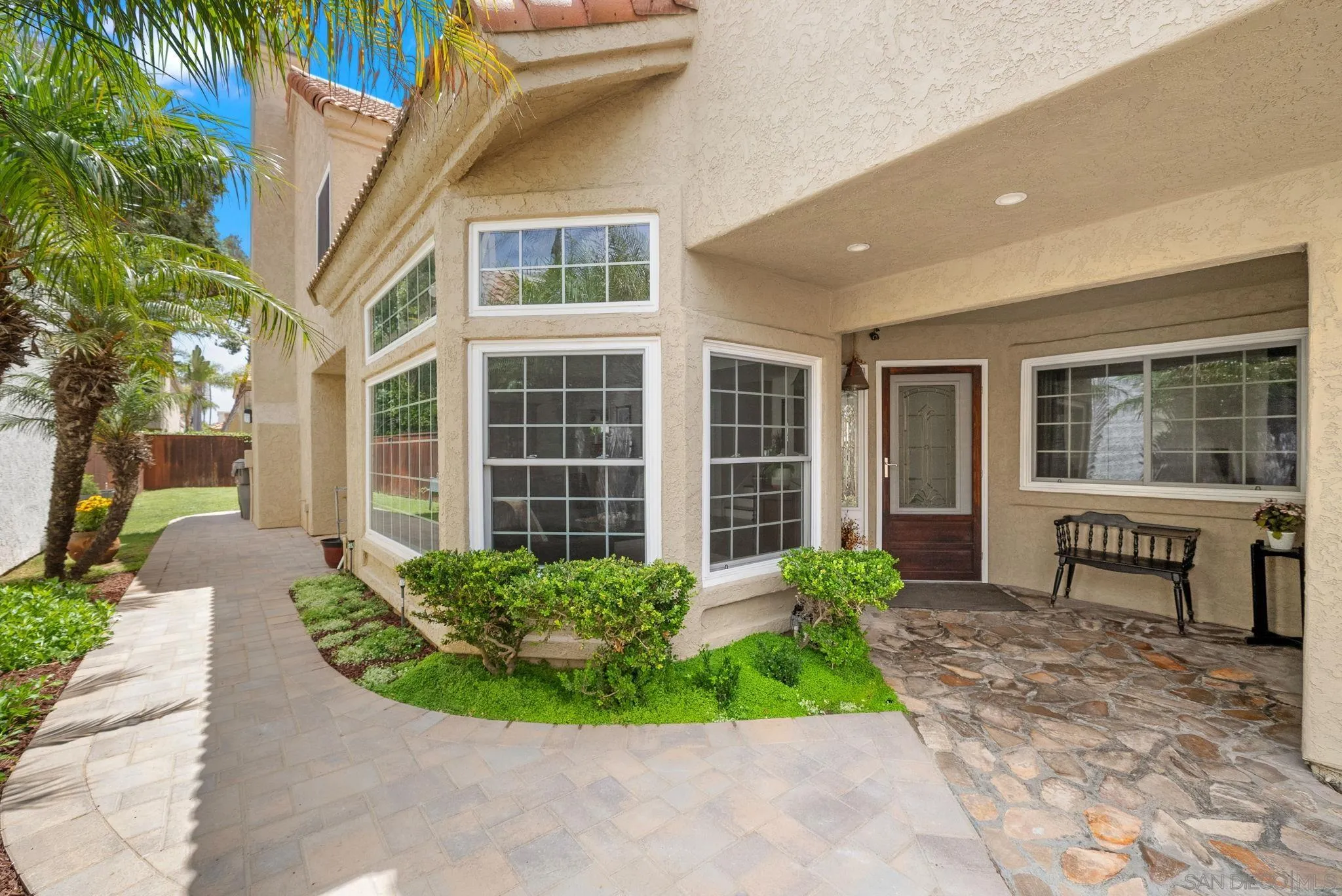 43 Port Royale Road Coronado, CA 92118 - Photo 5 of 42 a front view of a house with a garden and plants