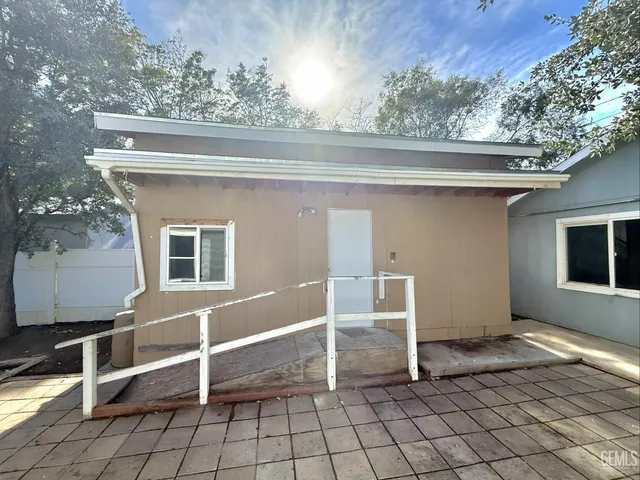 a view of a two chairs in the balcony