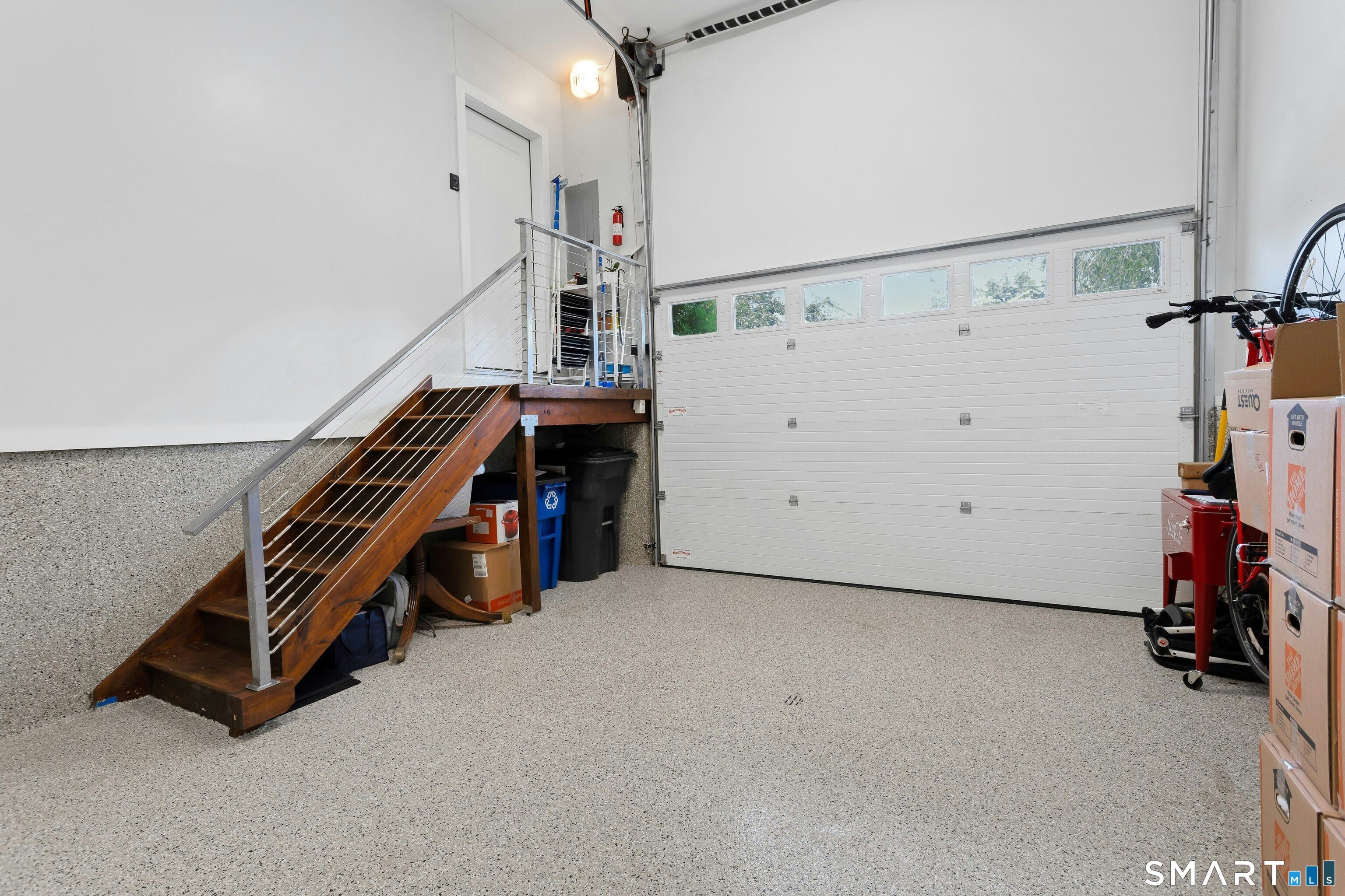 891 Oldfield Road Fairfield, CT 06824 - Photo 32 of 38 Spotless garage with vaulted ceiling and space to add a car-lift for an additional indoor parking space.
